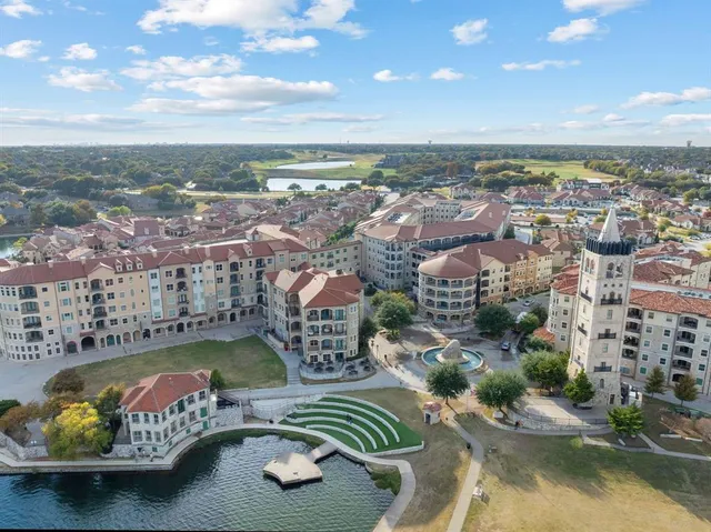 an aerial view of a house with a ocean view
