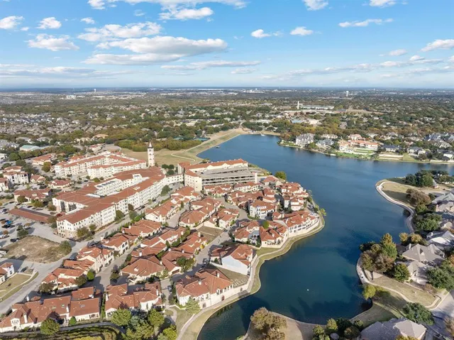 an aerial view of a house with outdoor space