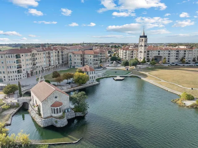 a view of a swimming pool with outdoor seating