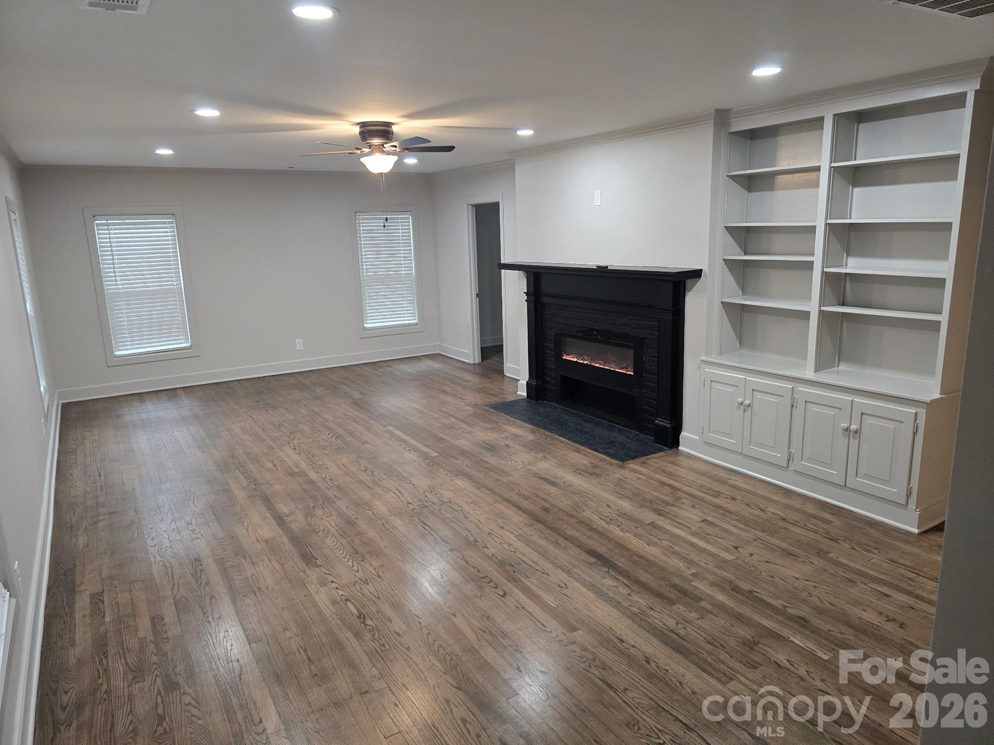 126 Sunset Drive Chester, SC 29706 - Photo 4 of 31 a view of an empty room with a fireplace and a window