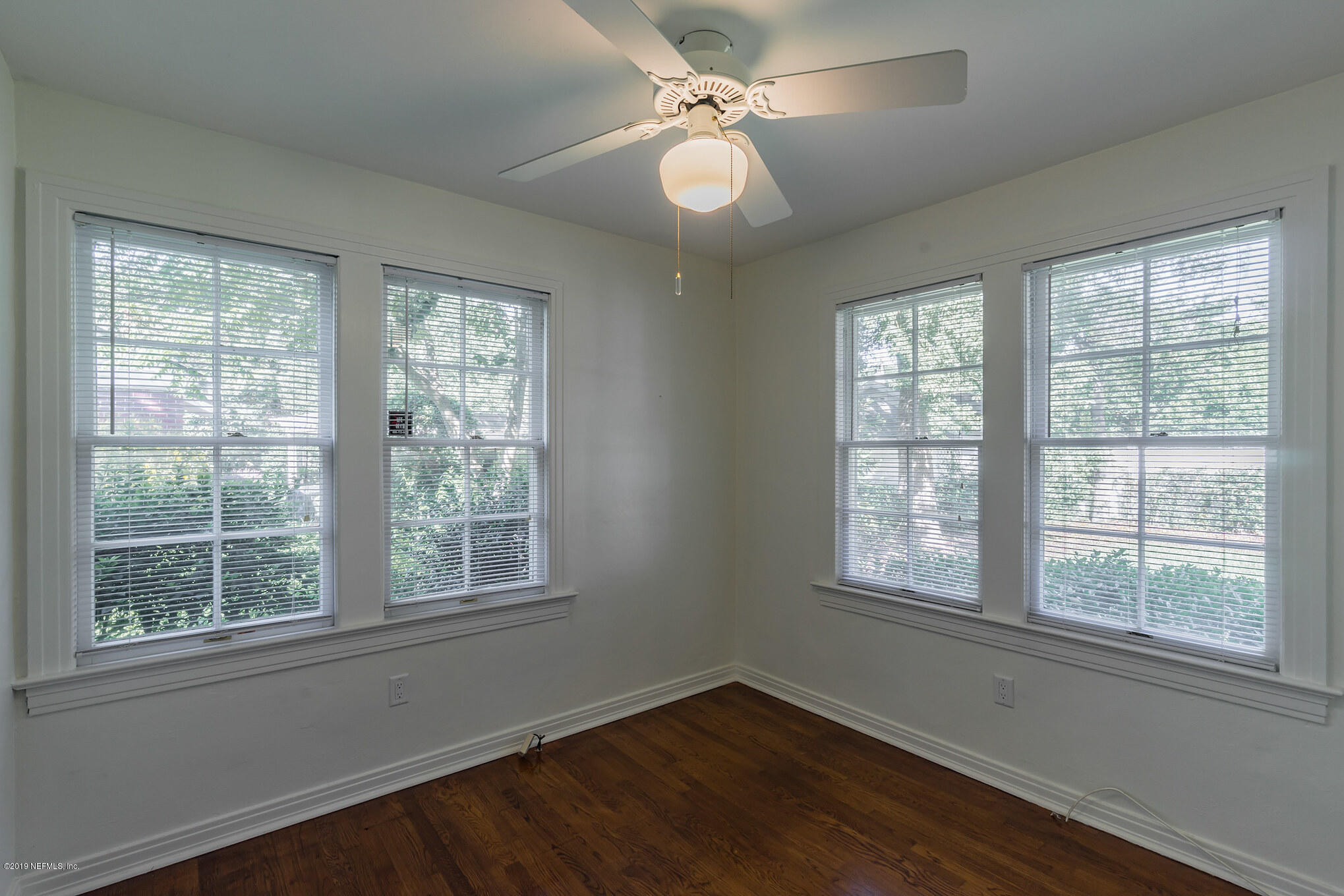 4134 Dover Road Jacksonville, FL 32207 - Photo 20 of 32 a view of an empty room with wooden floor and a window