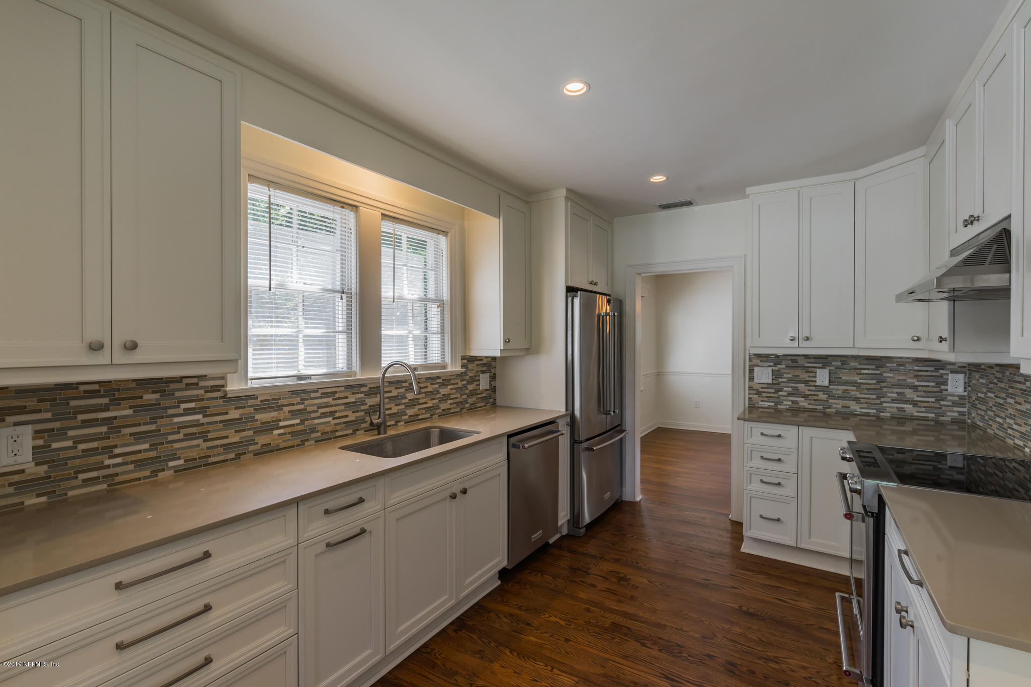 4134 Dover Road Jacksonville, FL 32207 - Photo 30 of 32 a kitchen with stainless steel appliances granite countertop a stove and a refrigerator