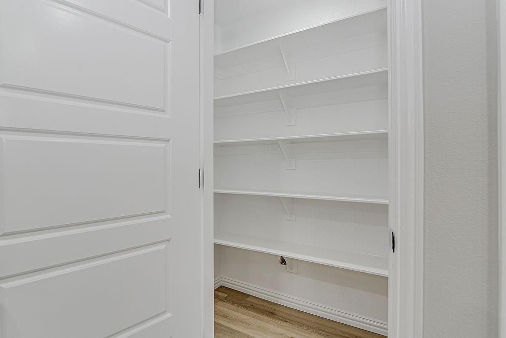 333 North Field Street Burleson, TX 76028 - Photo 11 of 35 a view of walk in closet with empty racks