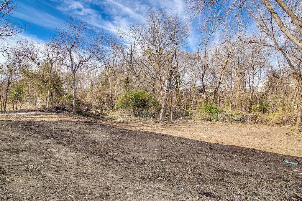 333 North Field Street Burleson, TX 76028 - Photo 12 of 35 a view of dirt yard with a large tree
