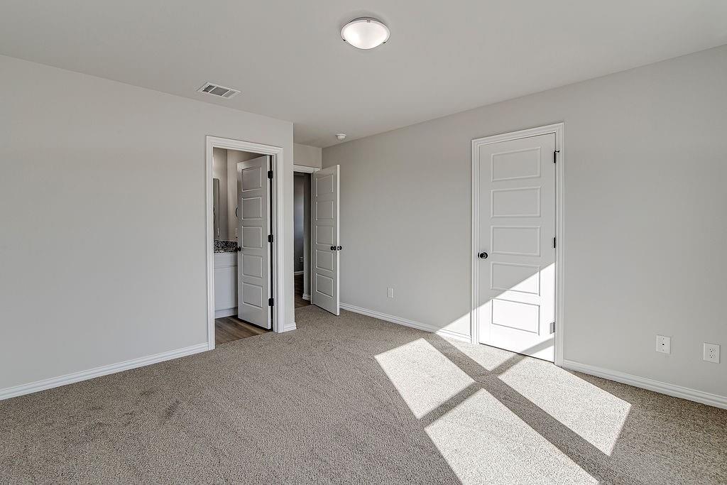 333 North Field Street Burleson, TX 76028 - Photo 16 of 35 an empty room with white walls and entryway