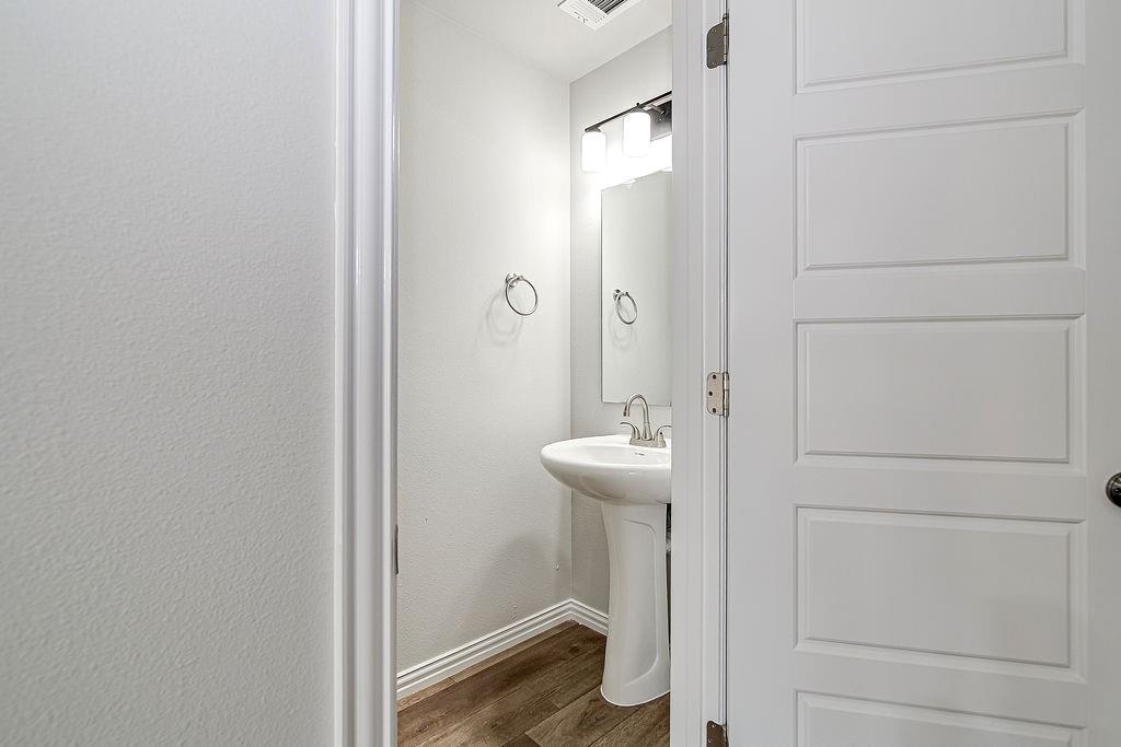 333 North Field Street Burleson, TX 76028 - Photo 32 of 35 a bathroom with a sink and mirror