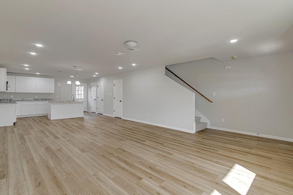 333 North Field Street Burleson, TX 76028 - Photo 4 of 35 a view of a kitchen with a sink and wooden floor