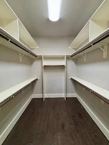 a view of an empty walk in closet