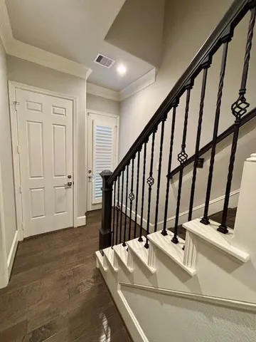 a view of staircase with white walls