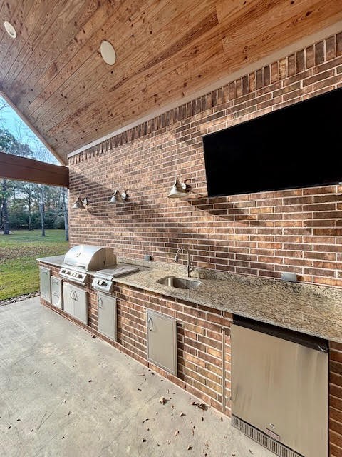 8970 Navigation Circle Montgomery, TX 77316 - Photo 43 of 47 a kitchen with stainless steel appliances granite countertop a sink and a stove