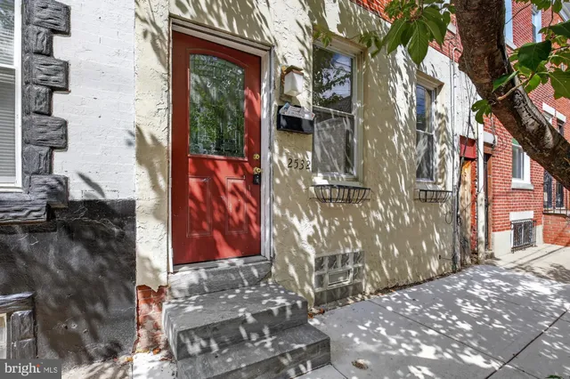 a view of a house with a street
