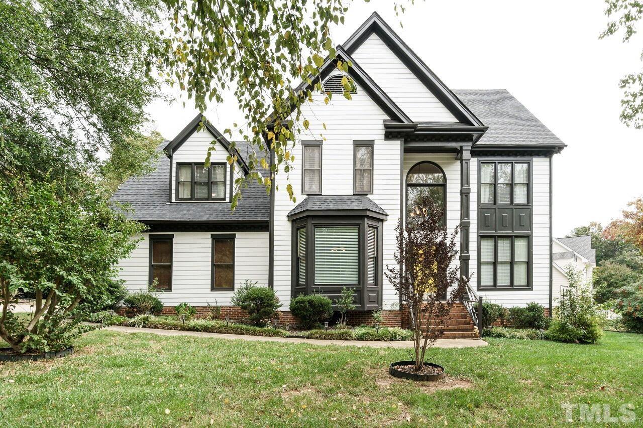7800 Laurel Mountain Road Raleigh, NC 27613 - Photo 1 of 31 a front view of a house with a yard