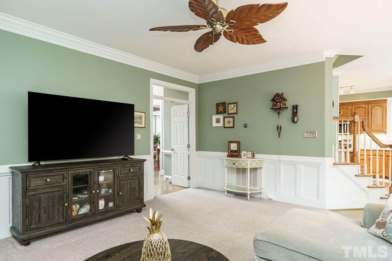 7800 Laurel Mountain Road Raleigh, NC 27613 - Photo 13 of 31 a living room with furniture and a flat screen tv