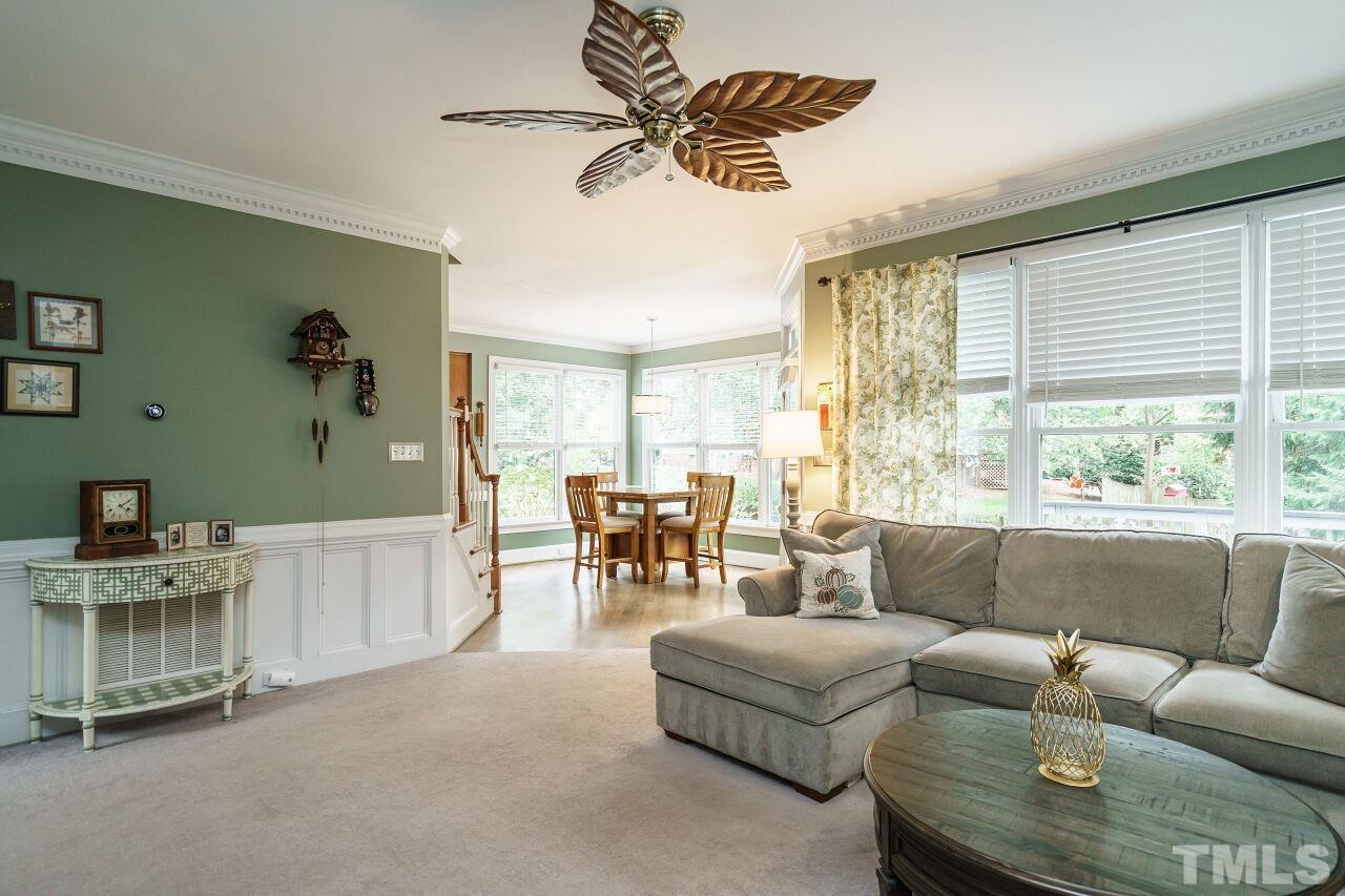 7800 Laurel Mountain Road Raleigh, NC 27613 - Photo 14 of 31 a living room with furniture and a large window