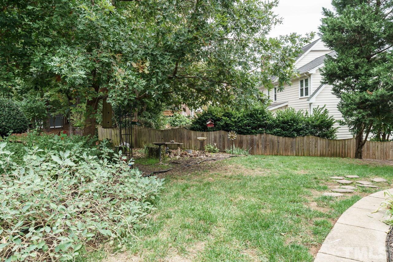 7800 Laurel Mountain Road Raleigh, NC 27613 - Photo 27 of 31 a view of a yard with a trampoline