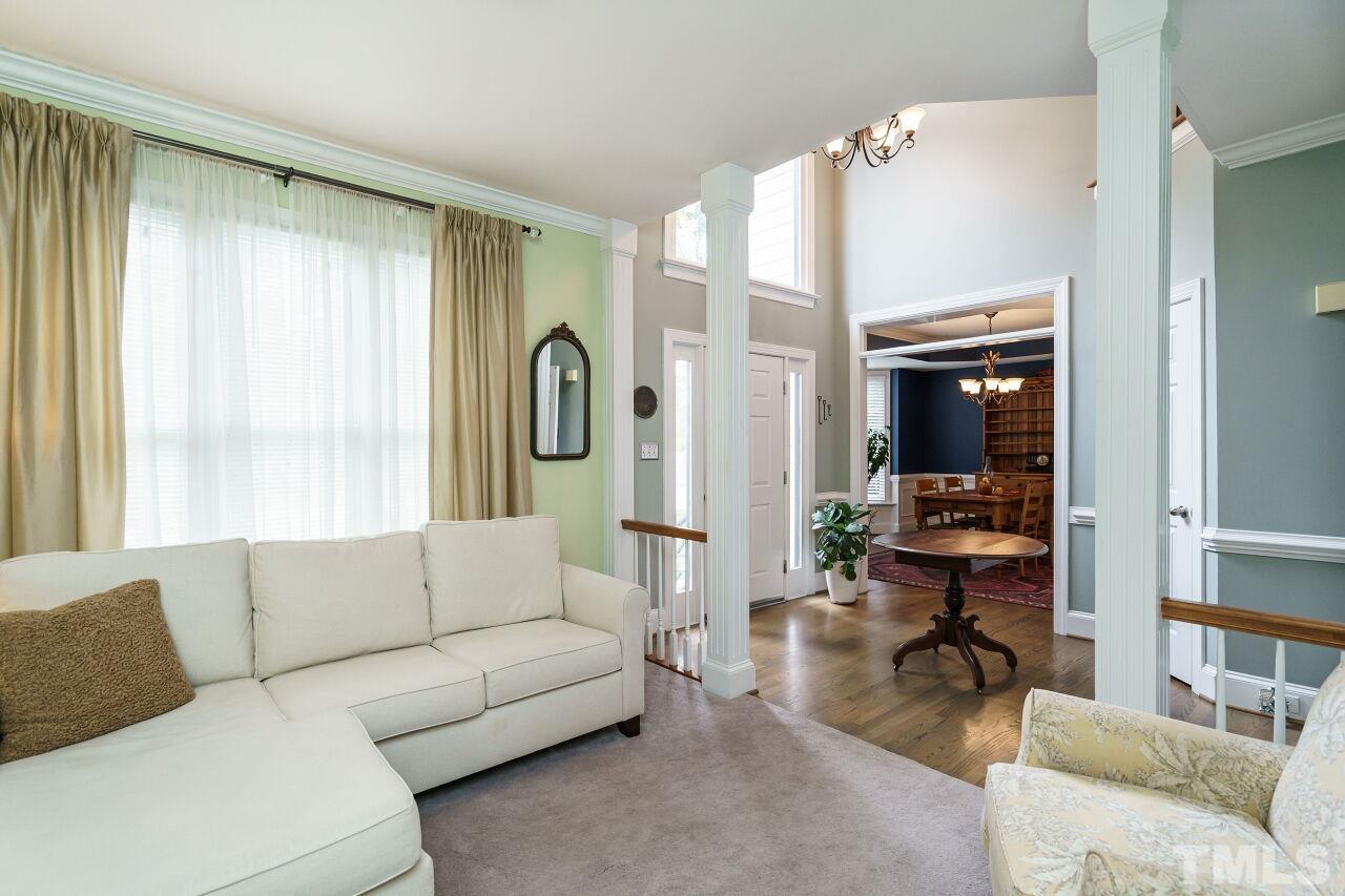 7800 Laurel Mountain Road Raleigh, NC 27613 - Photo 6 of 31 a living room with furniture and a large window