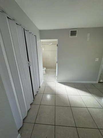 a view of balcony with wooden floor