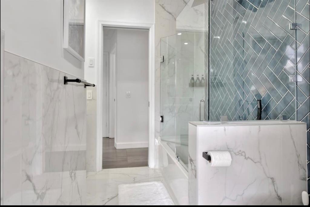 105 Orchard Ridge Lane Boca Raton, FL 33431 - Photo 15 of 24 a bathroom with a shower and a glass door