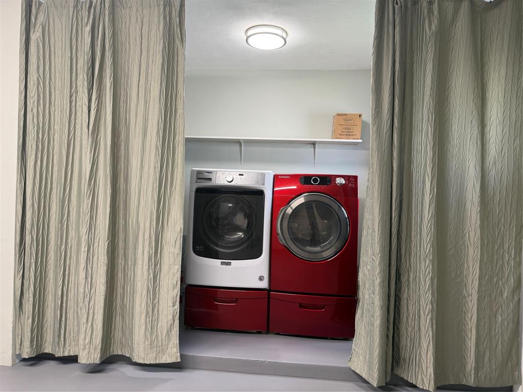 105 Orchard Ridge Lane Boca Raton, FL 33431 - Photo 20 of 24 a utility room with dryer and washer