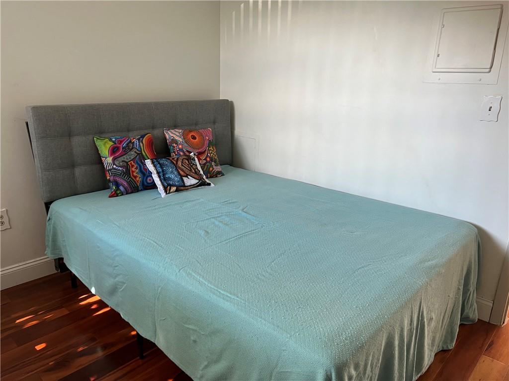 3256 Kennett Square Pittsburgh, PA 15213 - Photo 13 of 15 a bed sitting in a bedroom next to a window