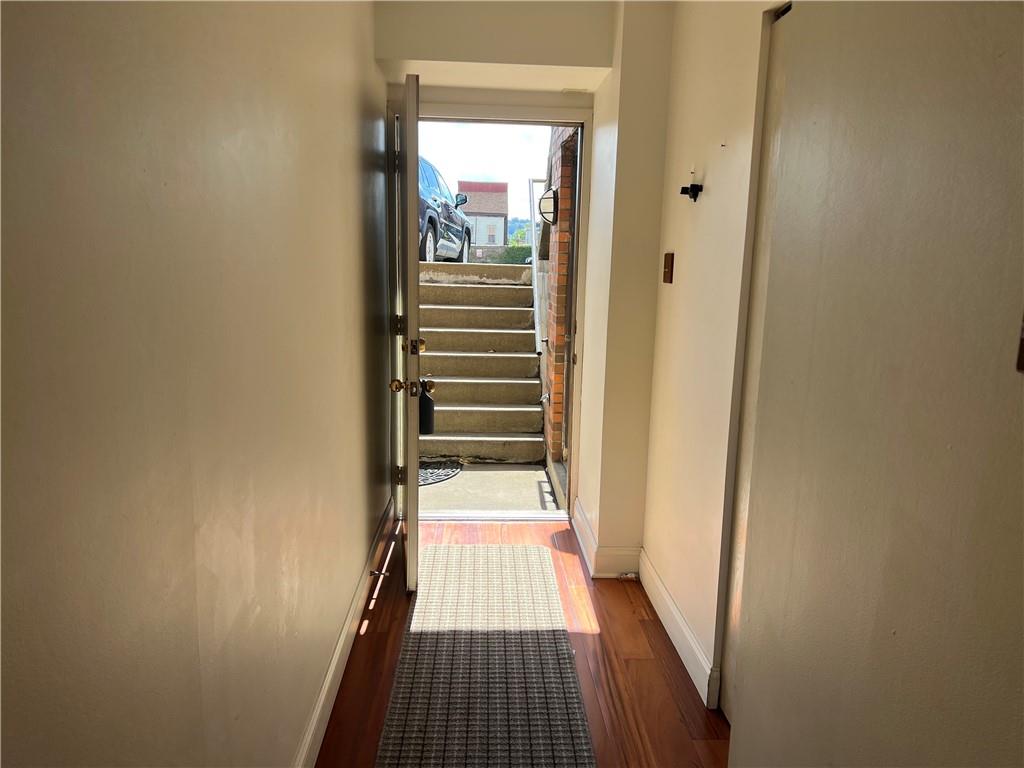 3256 Kennett Square Pittsburgh, PA 15213 - Photo 15 of 15 a view of a hallway with wooden floor and a bathroom