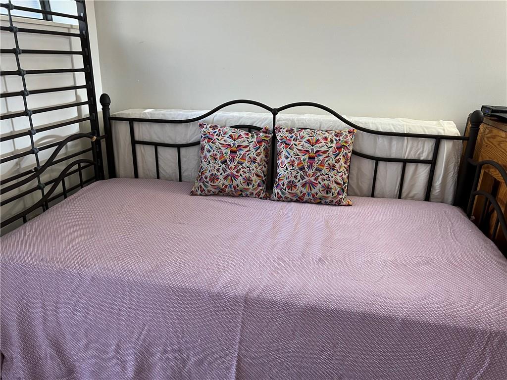3256 Kennett Square Pittsburgh, PA 15213 - Photo 3 of 15 a large bed sitting in a bedroom next to a lamp