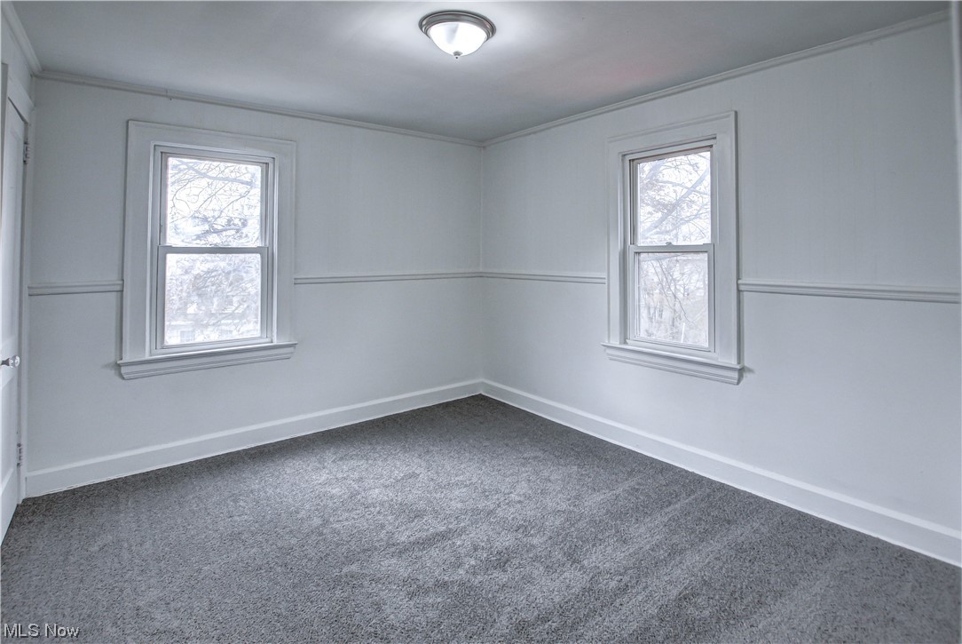 4764 Rockwood Road Cleveland, OH 44125 - Photo 18 of 35 Carpeted spare room with plenty of natural light