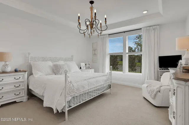 a bathroom with a sink a tub and a mirror