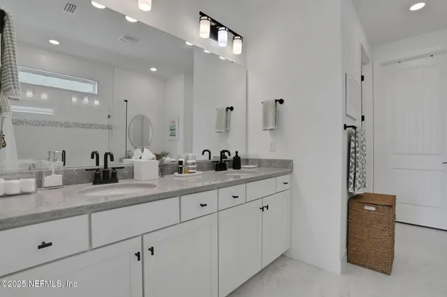 a bedroom with a bed and a cabinets