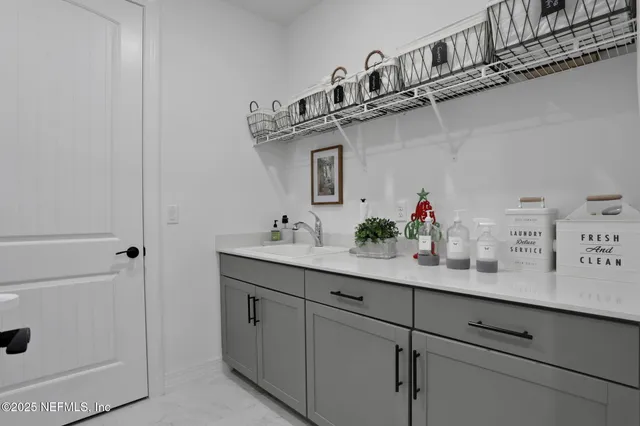 a view of a house with floor to ceiling windows and a basket ball poll