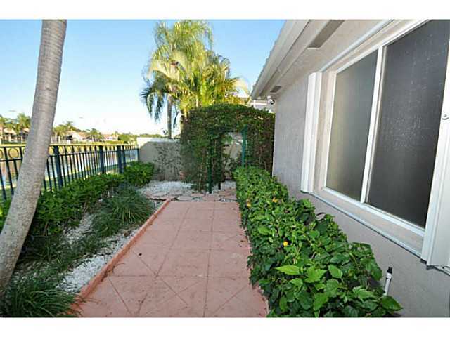 6293 Northwest 23rd Road Boca Raton, FL 33434 - Photo 18 of 25 a view of a back yard with flower plants