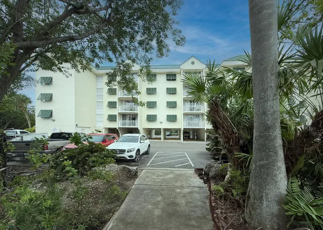 a bedroom with a bed and lamp on table