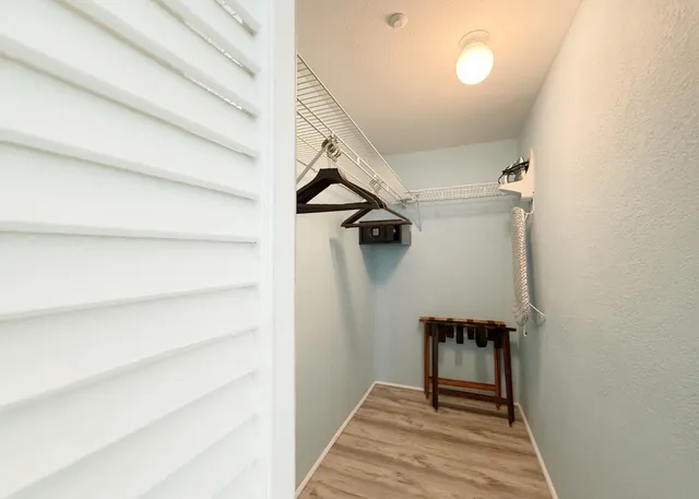 a view of a bedroom and a bathroom