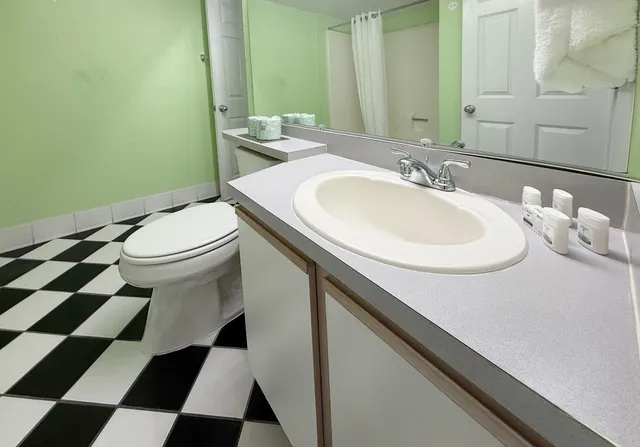 a bedroom with bed and a window