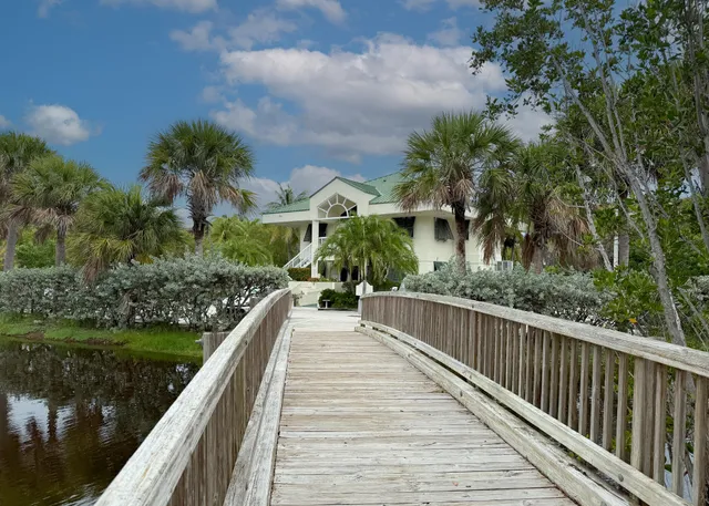 a view of a yard and front view of a house