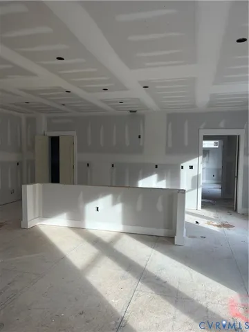 a large white kitchen with lots of counter space