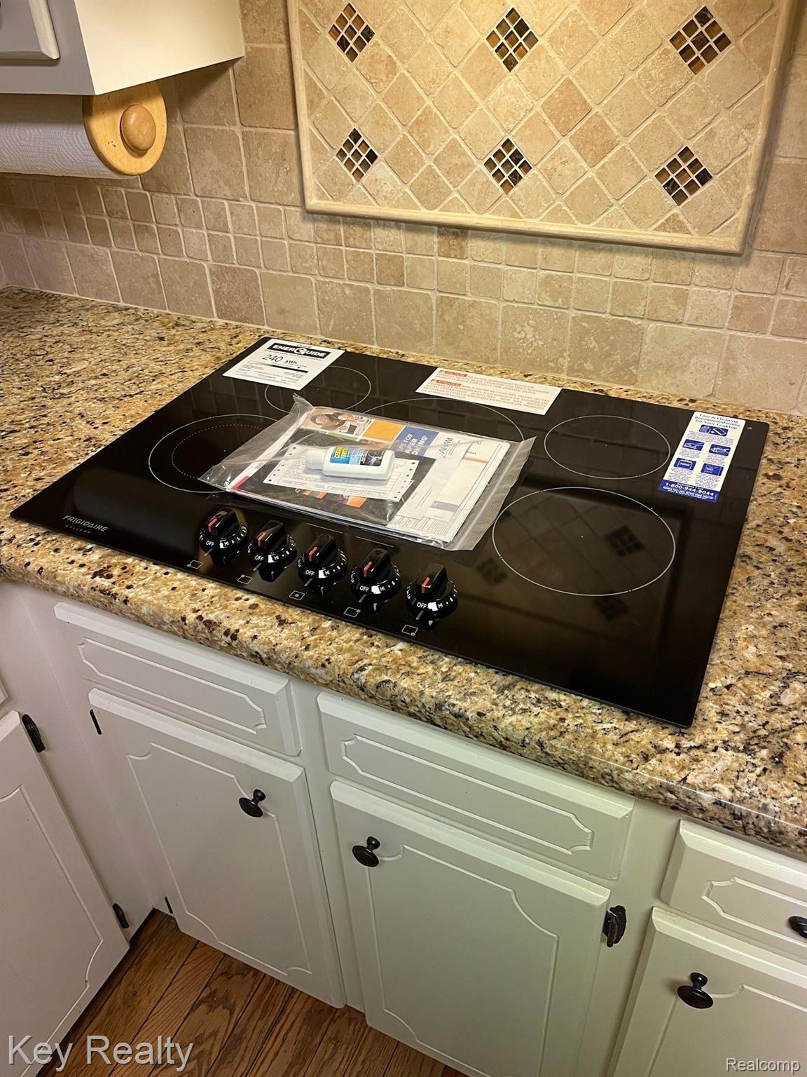 6231 Kings Shire Road Grand Blanc, MI 48439 - Photo 38 of 39 Brand new electric cooktop!