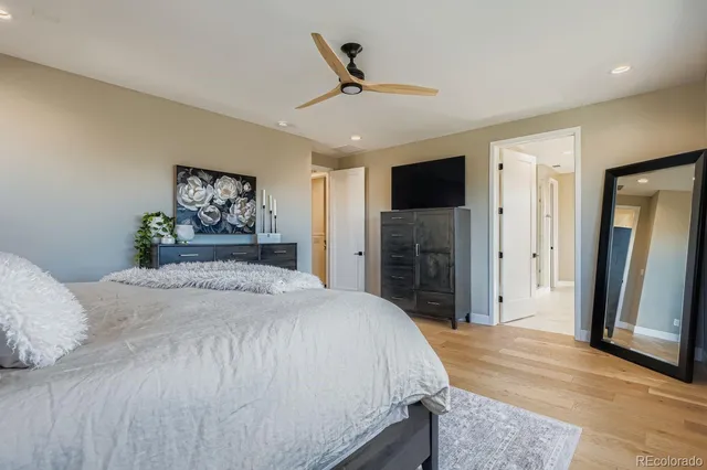 a bedroom with a bed and a television