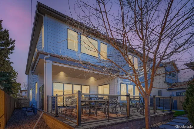 a view of a house with a large tree
