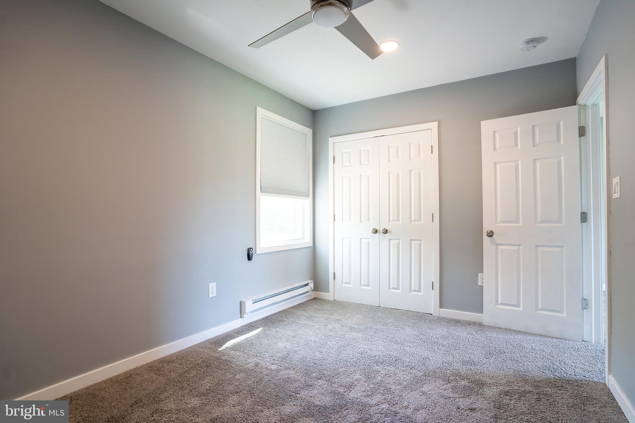 74 Woods Road Hightstown, NJ 08520 - Photo 18 of 57 a view of an empty room with a window