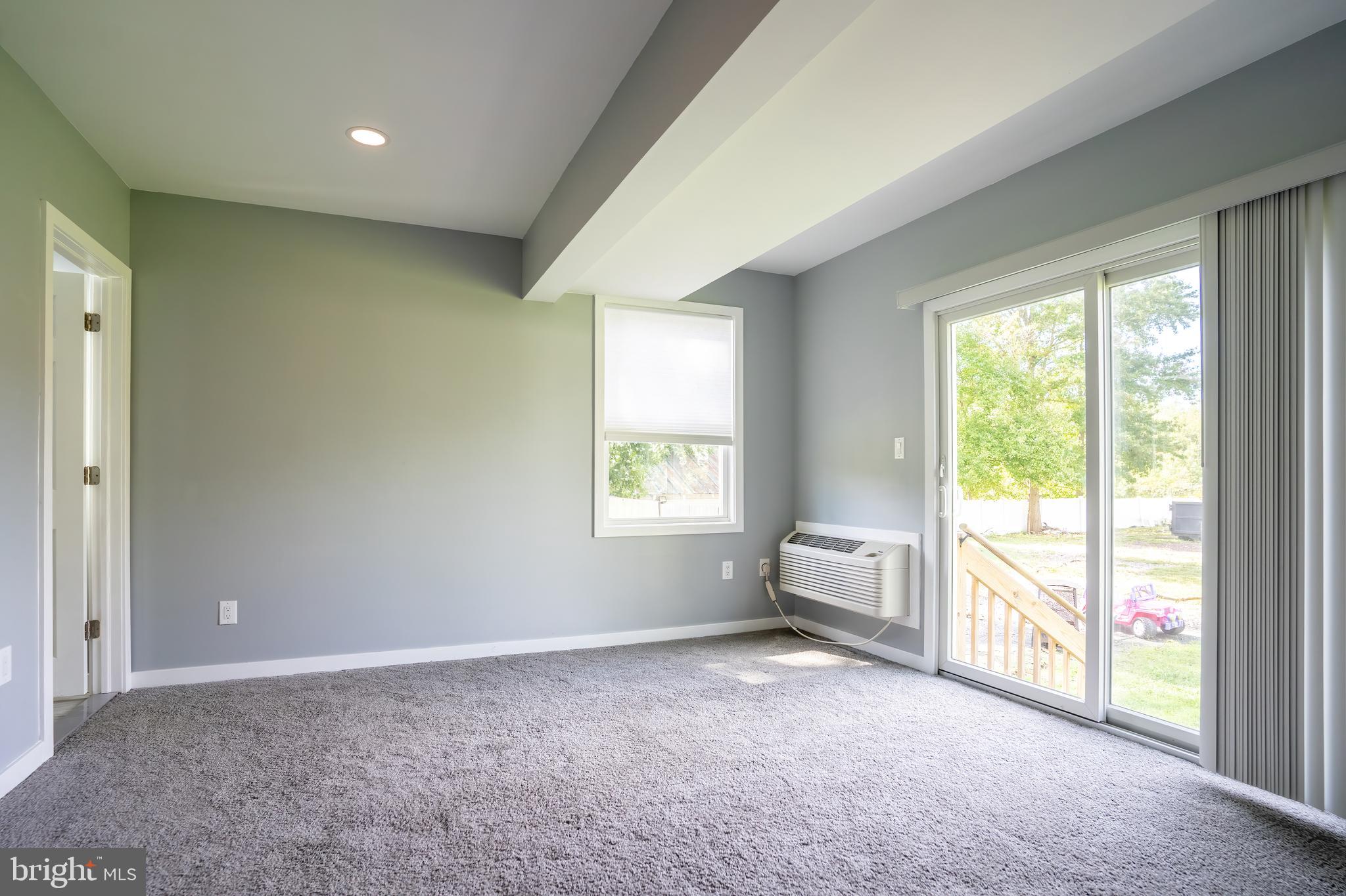 74 Woods Road Hightstown, NJ 08520 - Photo 19 of 57 a view of an empty room with a window