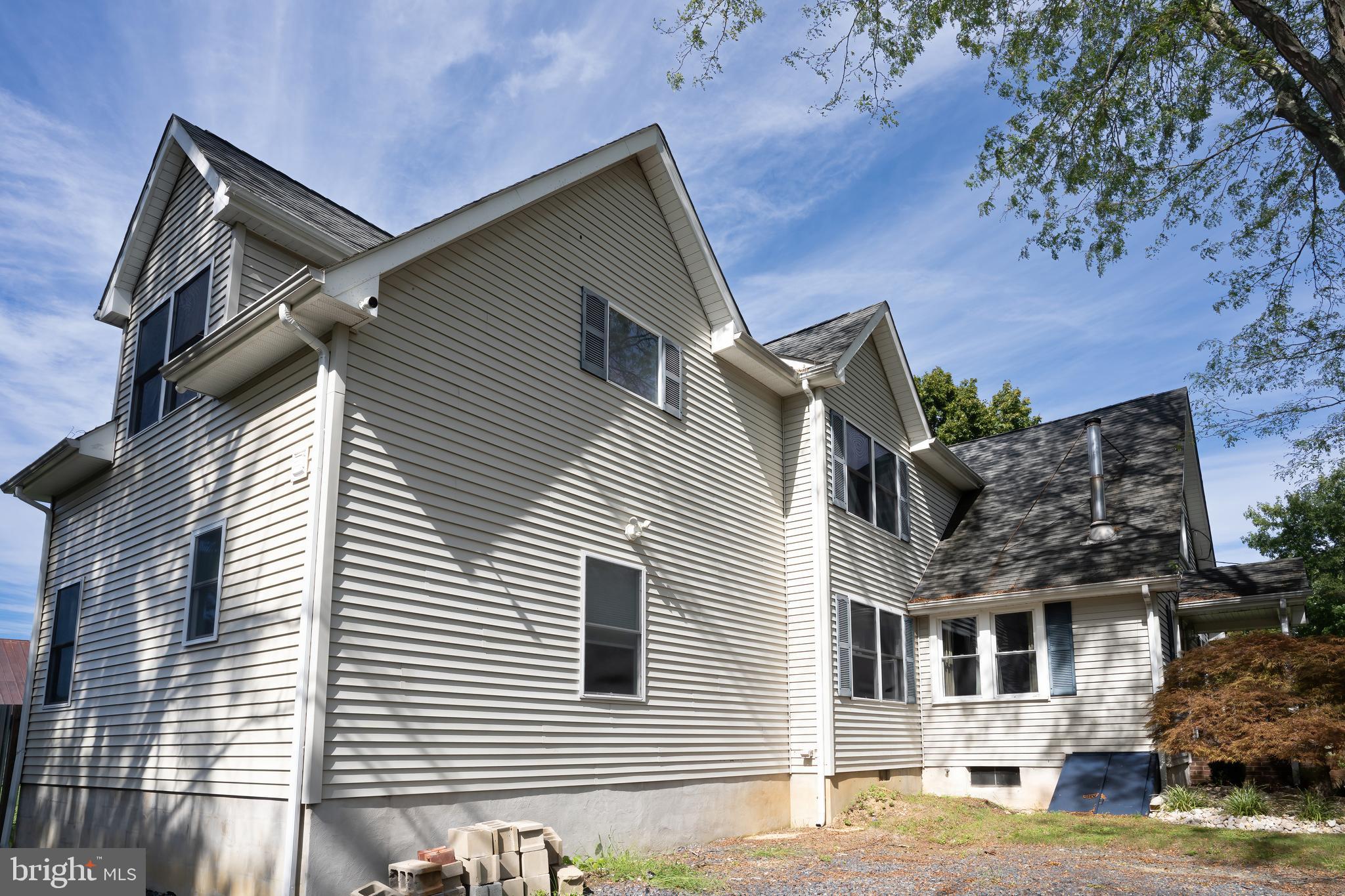 74 Woods Road Hightstown, NJ 08520 - Photo 2 of 57 a front view of a house with a yard