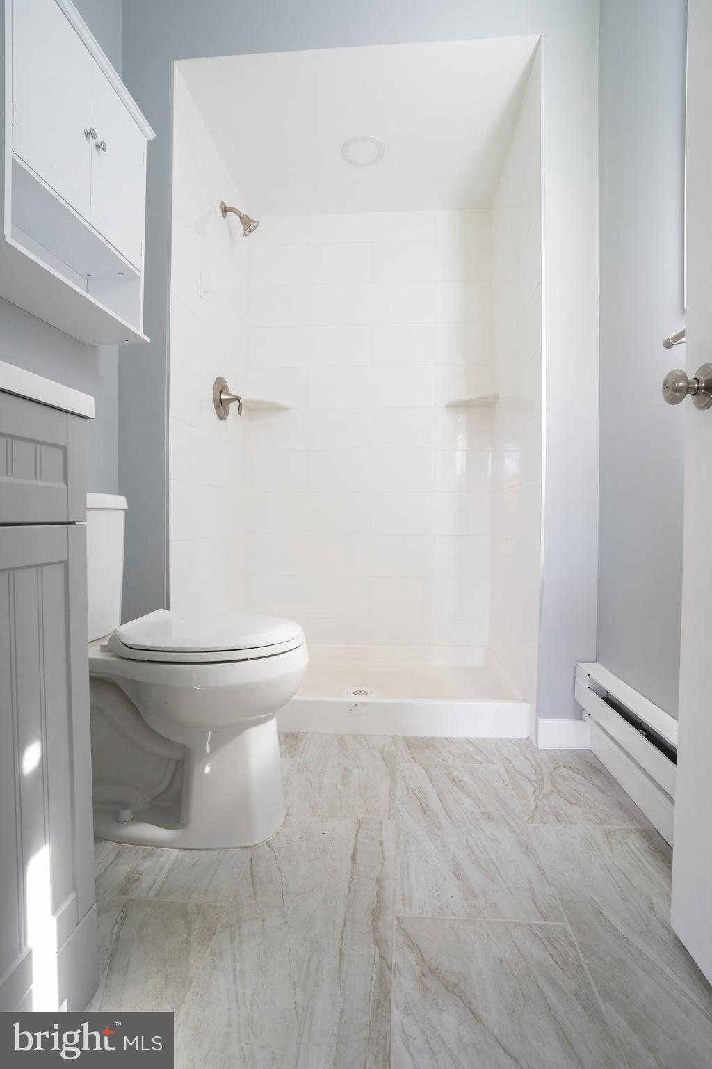 74 Woods Road Hightstown, NJ 08520 - Photo 21 of 57 a bathroom with a toilet and a shower