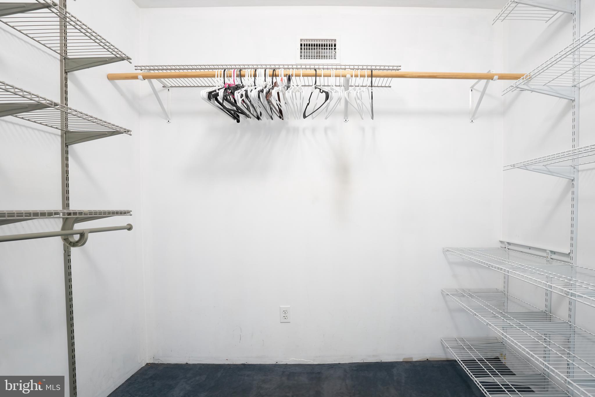 74 Woods Road Hightstown, NJ 08520 - Photo 23 of 57 a view of storage and utility room with racks on the wall
