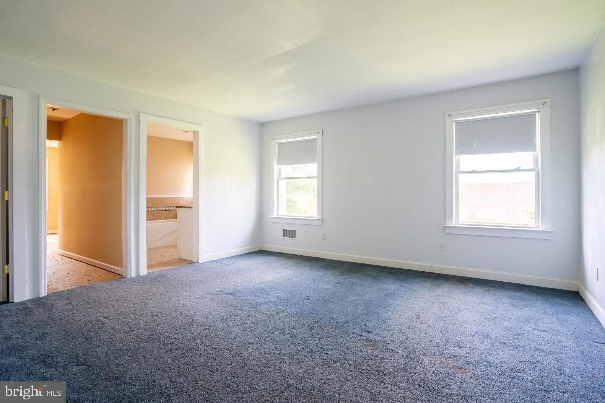 74 Woods Road Hightstown, NJ 08520 - Photo 27 of 57 an empty room with windows and closet