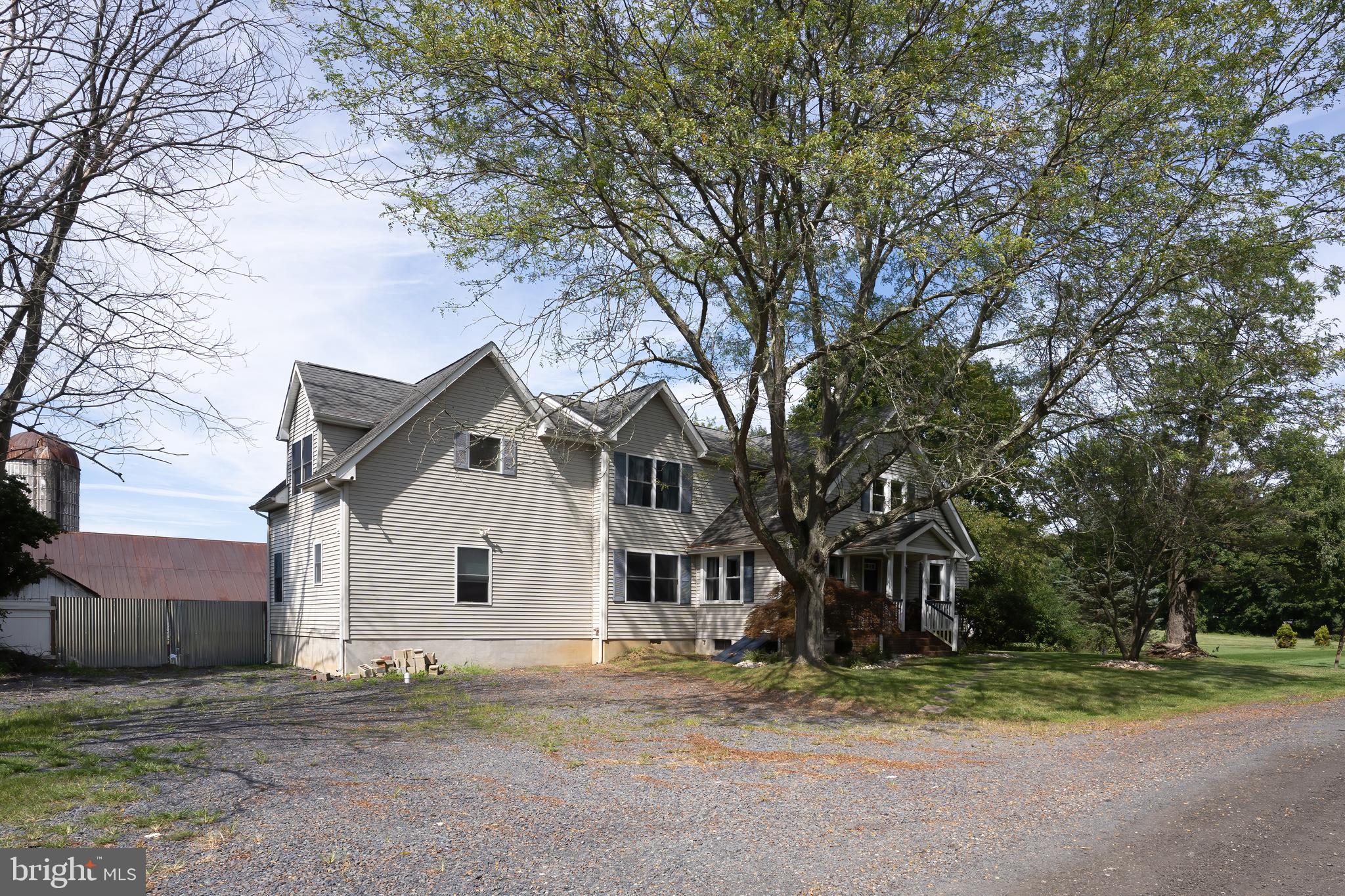 74 Woods Road Hightstown, NJ 08520 - Photo 3 of 57 a view of a house with a yard and large tree