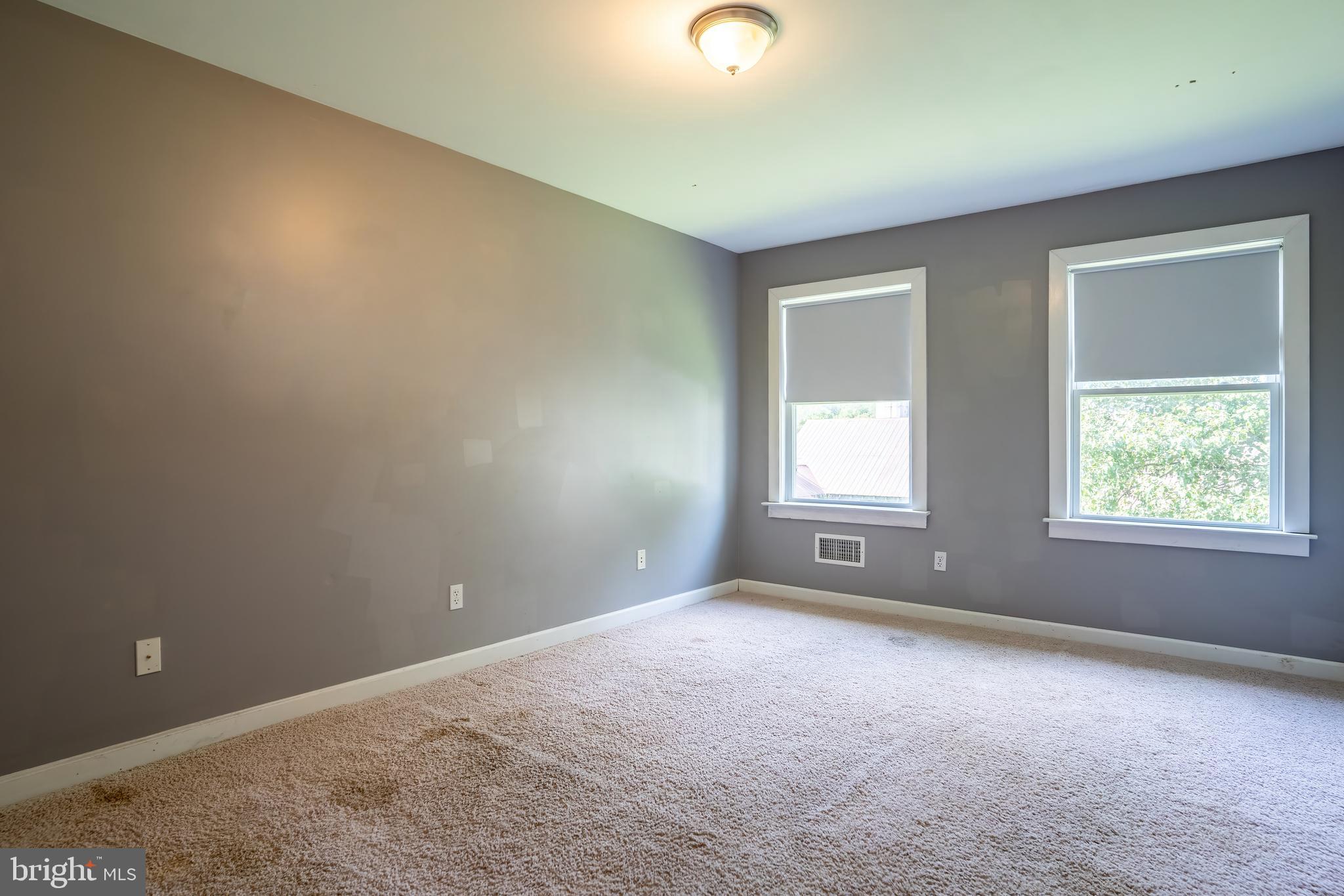 74 Woods Road Hightstown, NJ 08520 - Photo 31 of 57 an empty room with windows