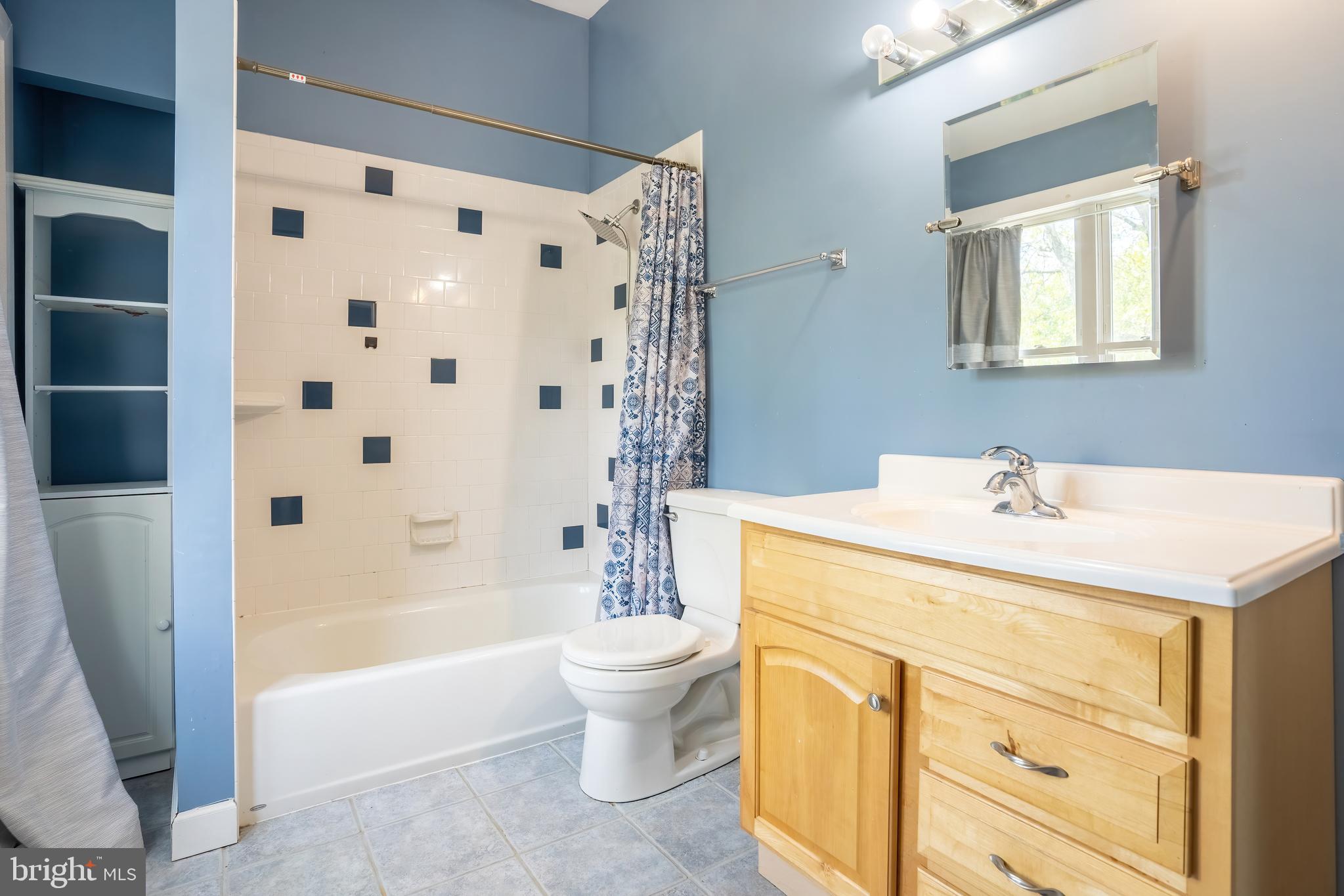 74 Woods Road Hightstown, NJ 08520 - Photo 34 of 57 a bathroom with a sink a toilet and a bathtub