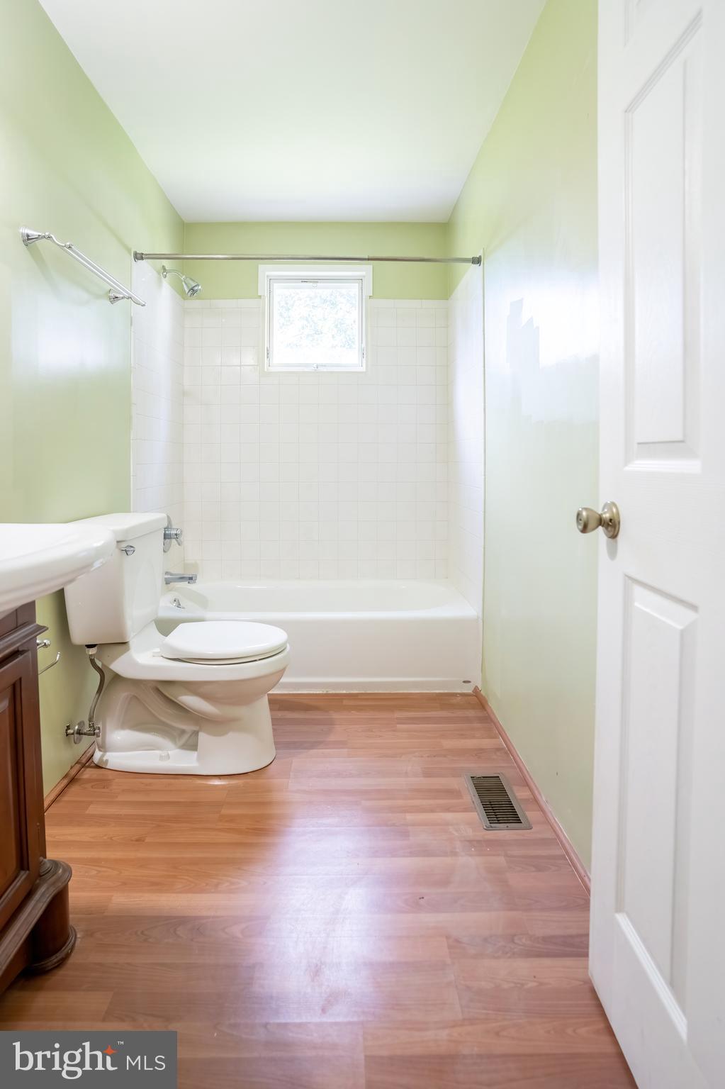 74 Woods Road Hightstown, NJ 08520 - Photo 41 of 57 a bathroom with a toilet a sink and a bathtub