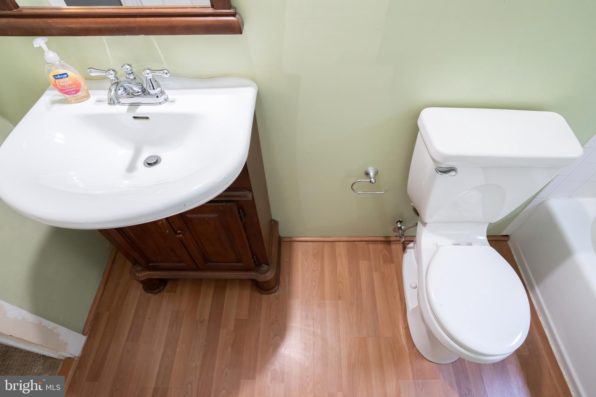 74 Woods Road Hightstown, NJ 08520 - Photo 42 of 57 a bathroom with a toilet sink and mirror